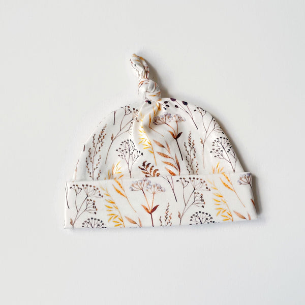 Baby muts van tricot met bloemetjes