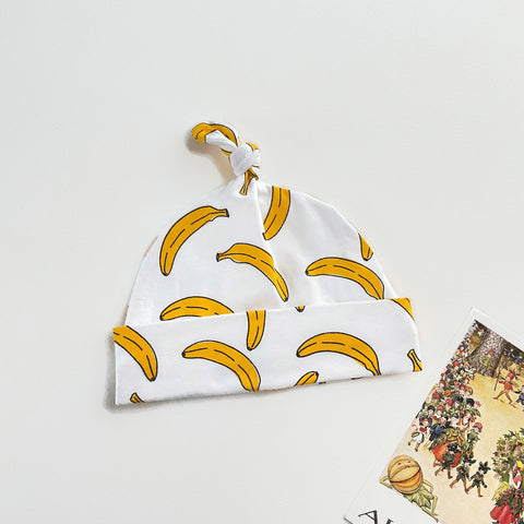 Wit knoopmutsje met bananen